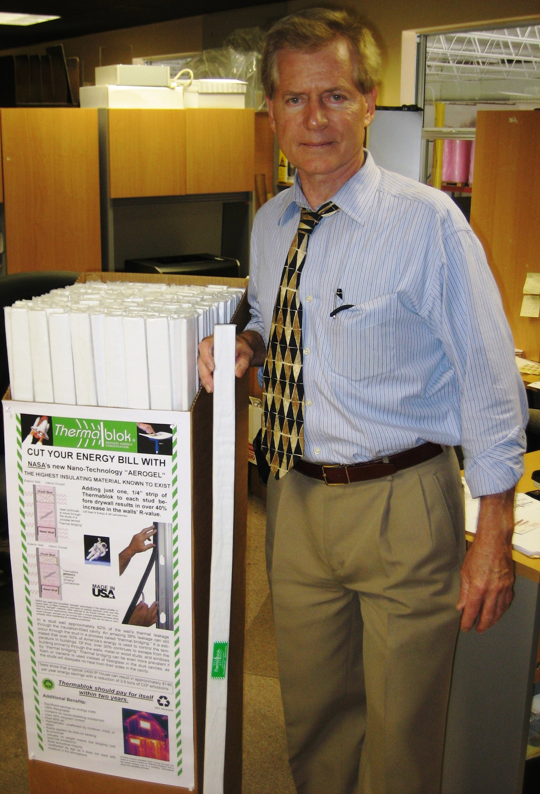 Thermablok founder Lahnie Johnson with a box of Thermablok Aerogel Insulation strips which NASA named as a Spinoff product in the agency's Spinoff Magazine.