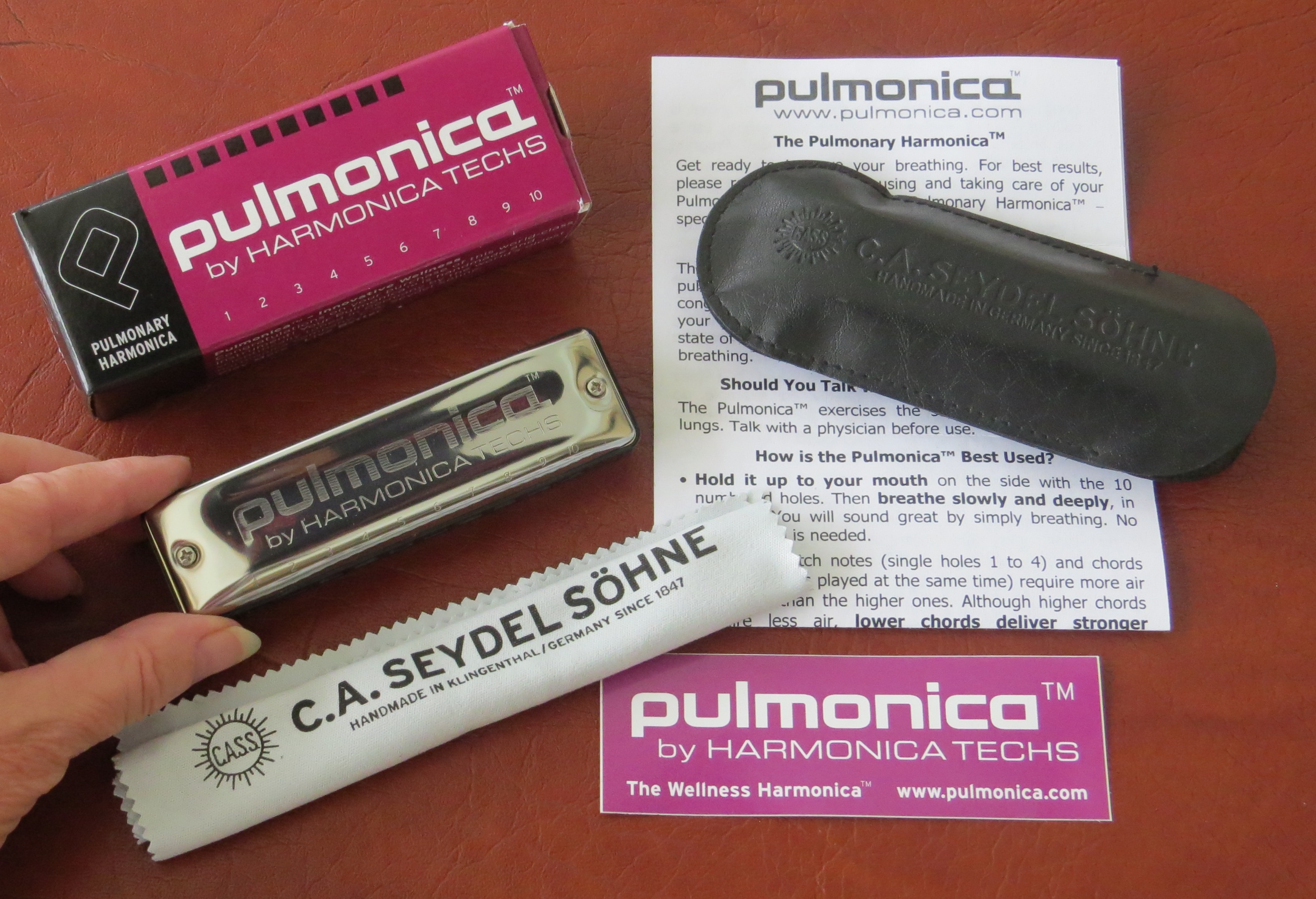 Pulmonica and box, cloth, carrying case, instructions, sticker