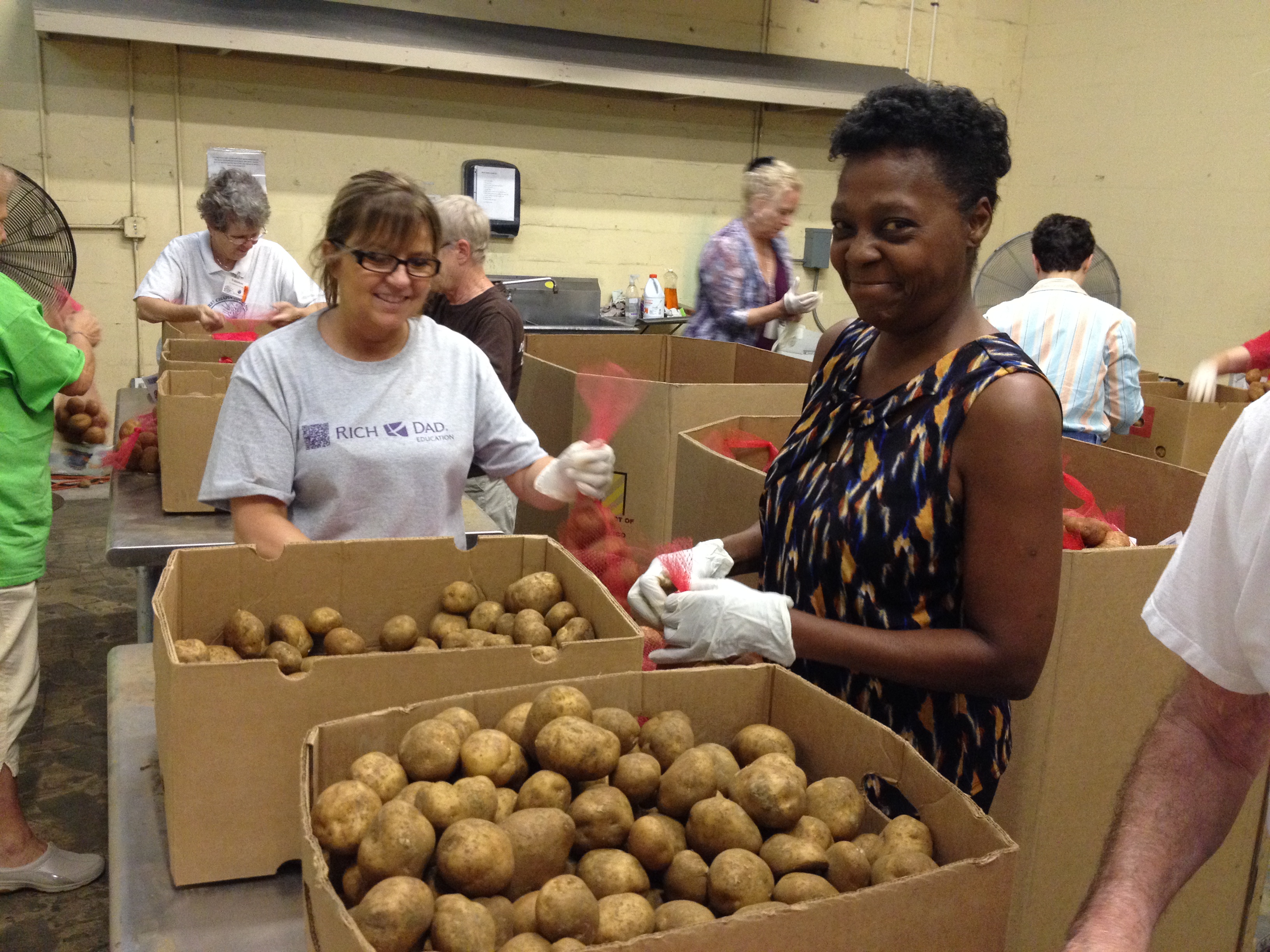 Rich Dad Education employees volunteer at the Harry Chapin Food Bank