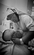 Sr. Urbani, medical officer at St. Joseph's Hospital, cradles a child. (Ron Ashley Photo)