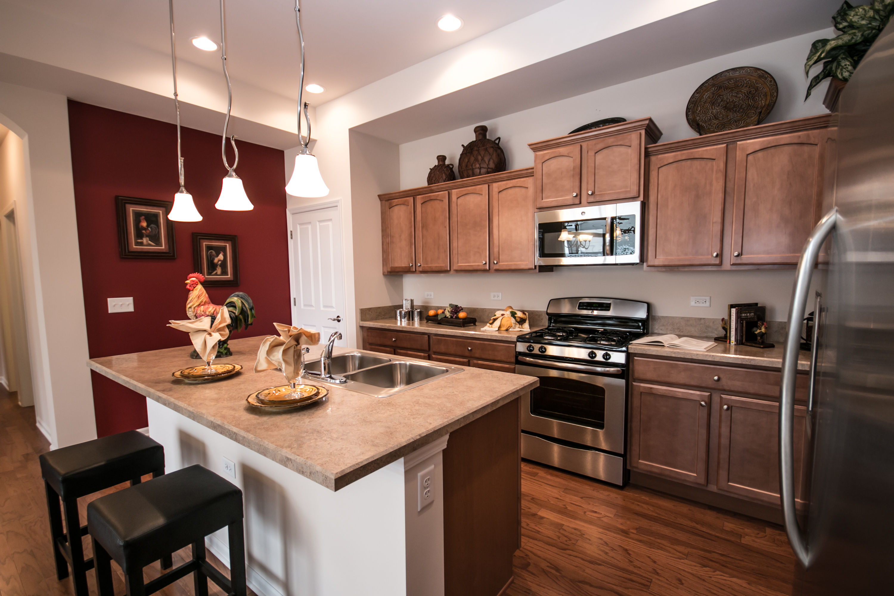 The Promenade Ranch Model offers a roomy kitchen with island.