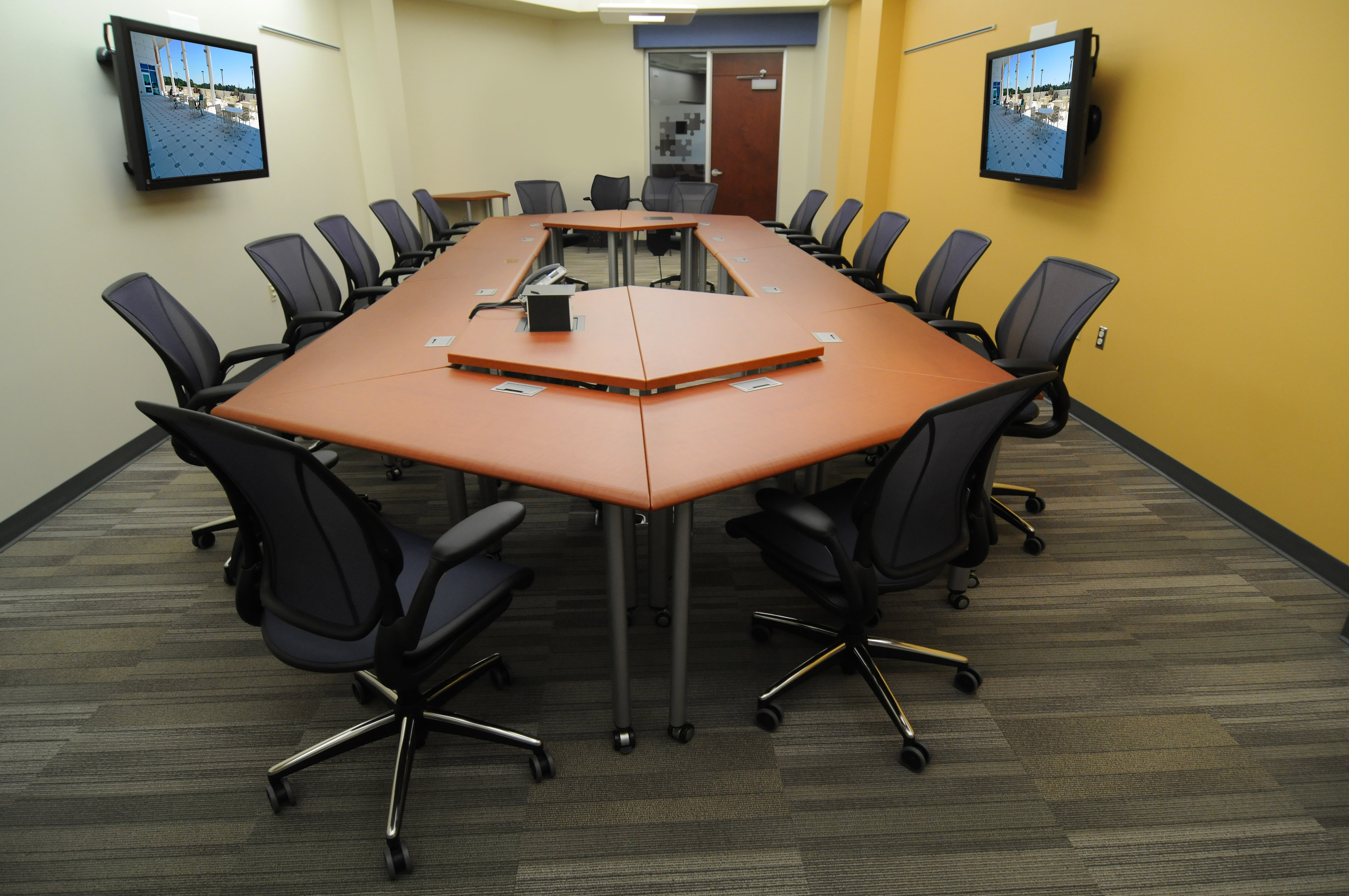 Trapezoid elements combine to form a conference table or smaller arrangements for breakouts.