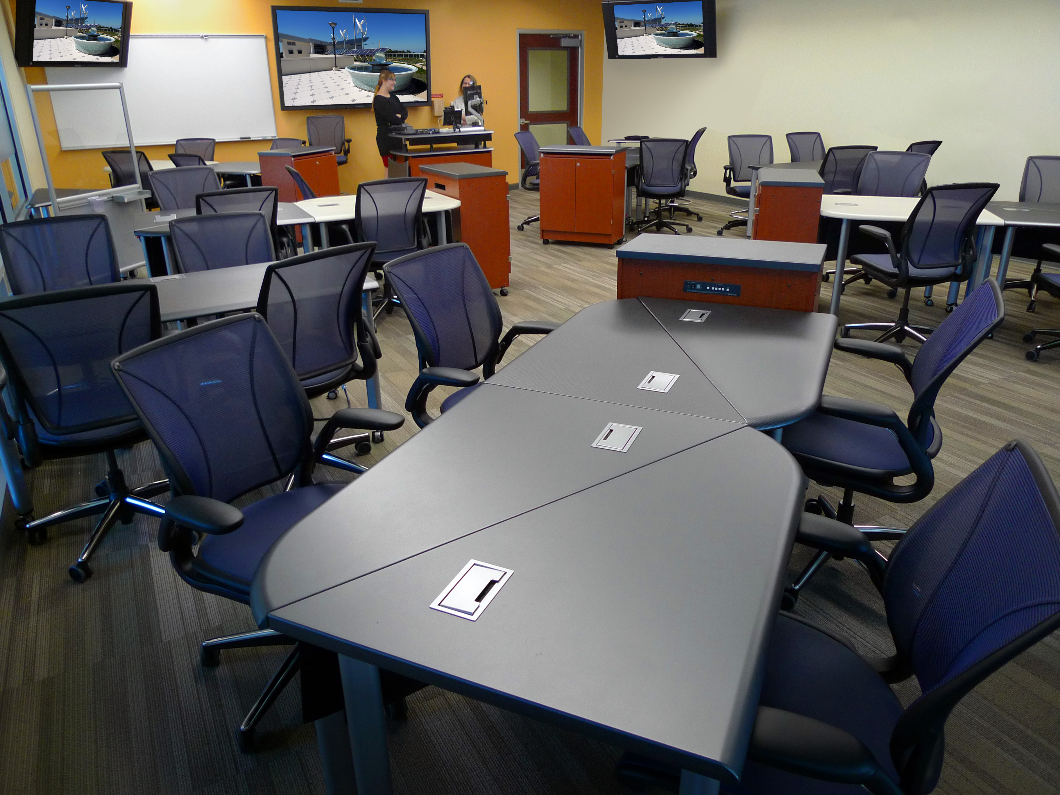 iGroup Collaboration Tables, set in Linear Offset, with Presence AV Cabinets