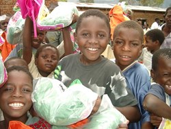 Kids in Malawi with mosquito nets