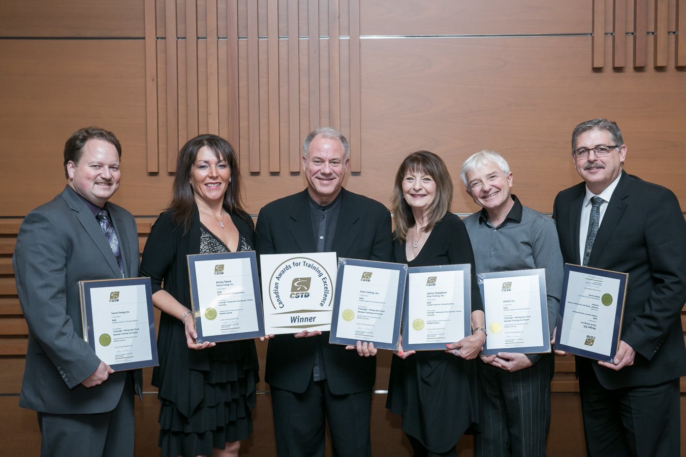 Representatives from VISTA Training, SUNCOR ENERGY and SIMLOG pose with Gold Awards at the CSTD awards ceremony in Toronto