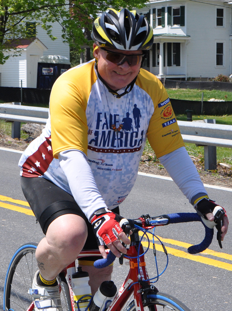 Army veteran Geoffrey Moulton serves as a ride marshal for the Face of America ride. Photograph by Van Brinson.