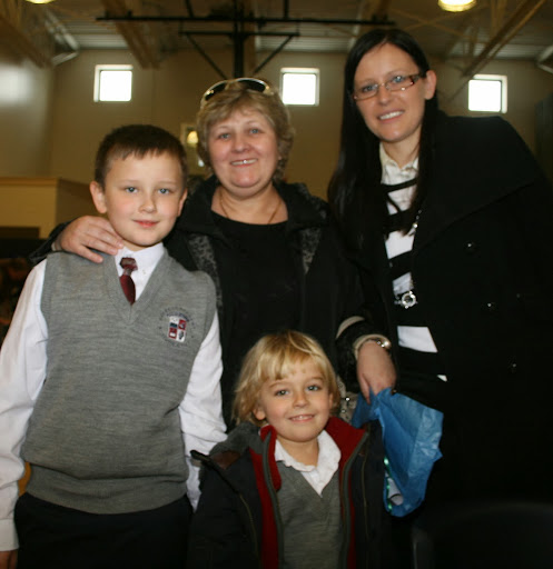 Nicolas & Max Krzywiec of Lemont celebrate with their Grandmother at Everest Academy.