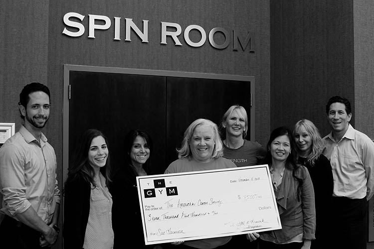 Proclinix, THE GYM of Armonk and Escape Spa and Wellness present Sue Harmon and the American Cancer Society with their donation check