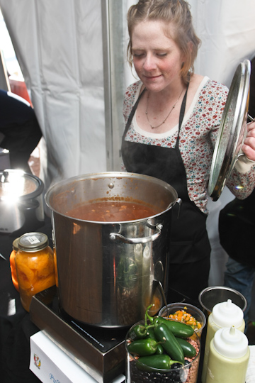 A contestant checks on her chili at the ANB Bank Ski Spree Chili Cook-off