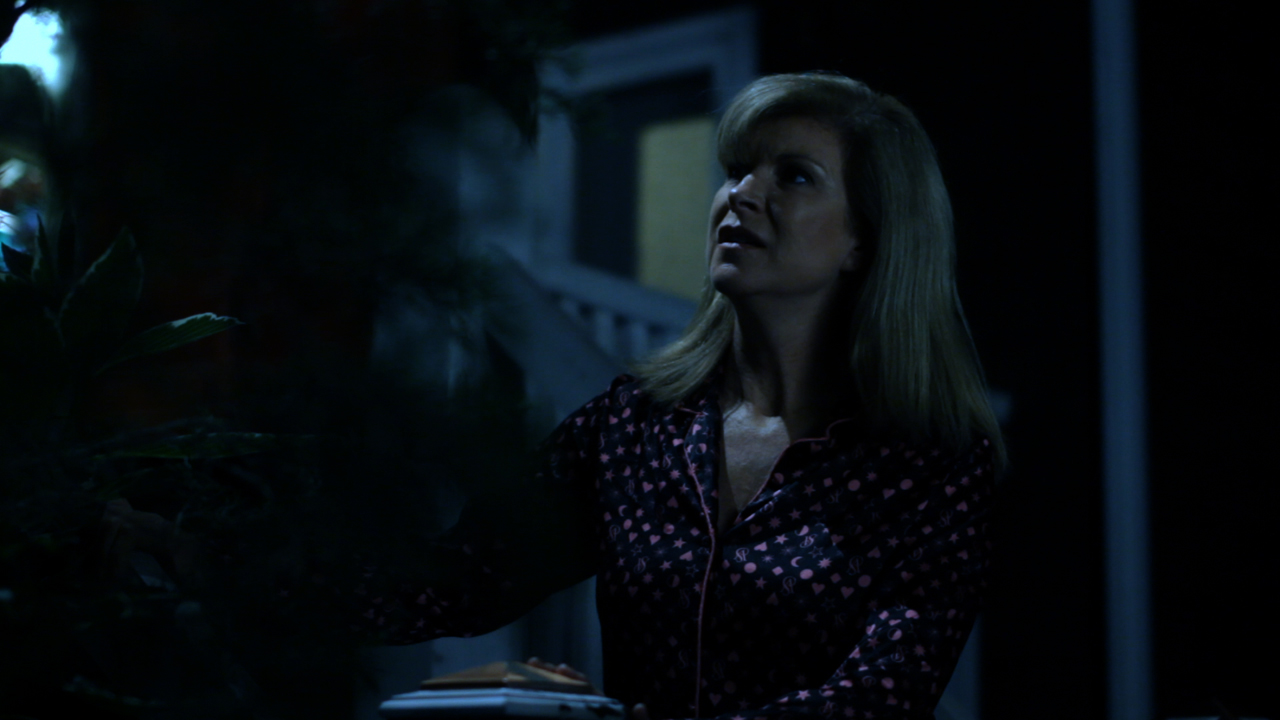 Alice Hardy (played by Tracie Savage, Friday the 13th- Part 3) wonders if her new neighbor has murdered his wife in Mike Gutridge's, "ThE bOnE gArDeN!"