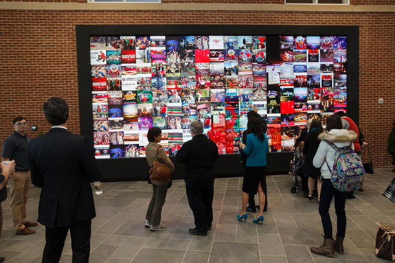 Guests enjoy a 24-by-11-foot media wall equipped with Microsoft Kinect movement recognition technology during the grand opening of the Liberty University Jerry Falwell Library.