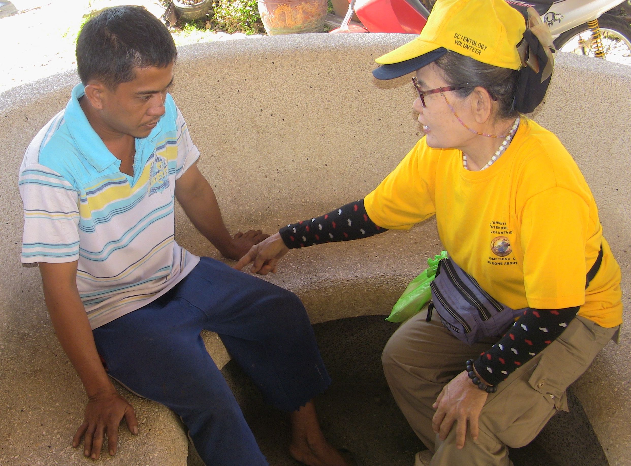 Scientology Volunteer Minister provides a Scientology assist to a young man in the city of Tacloban in the Philippines.