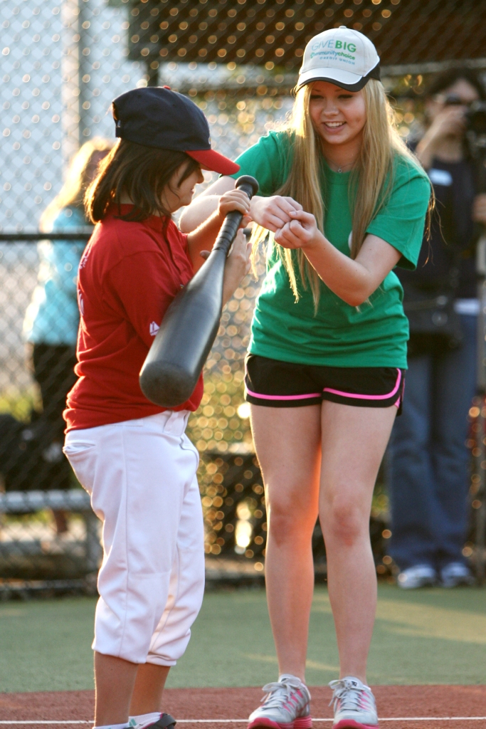 Lauren Krzisnik helps her Miracle League buddy while volunteering with The Miracle League of Michigan.