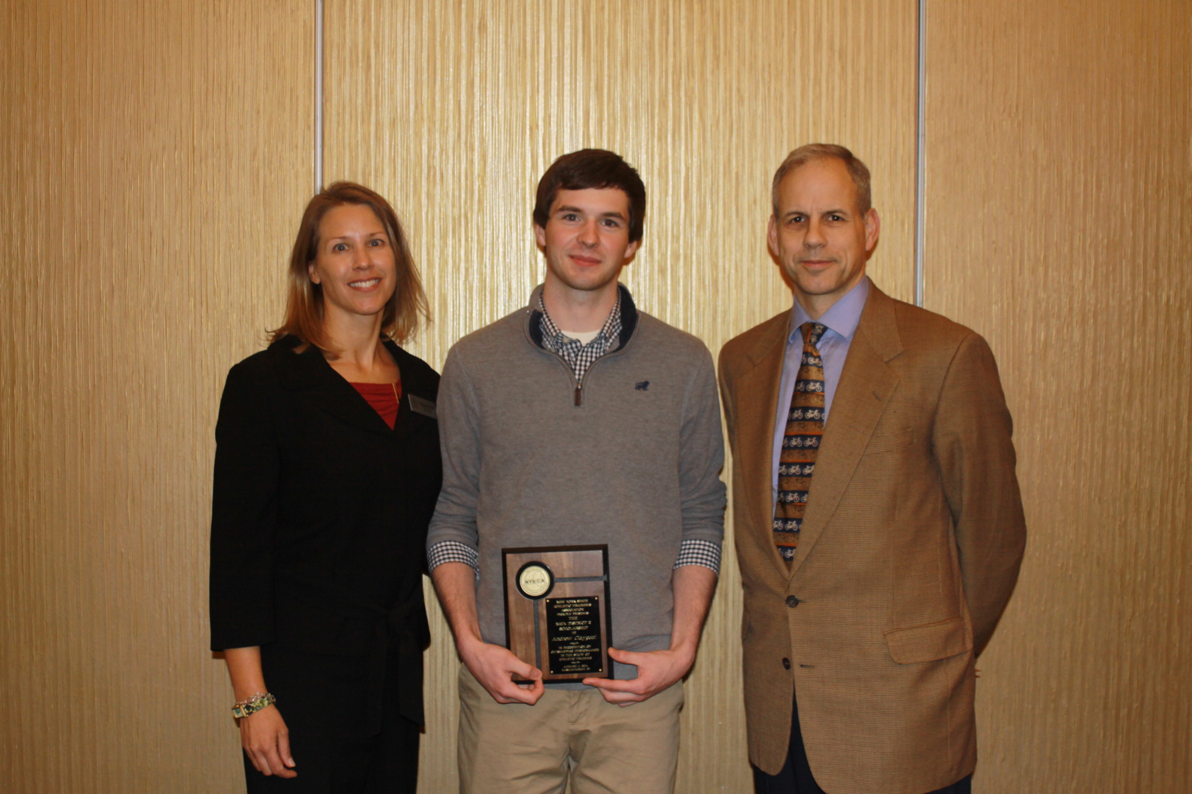 The recipient of the NATA District 2 Scholarship for NYS was Andrew Claypool of Ithaca College (center).