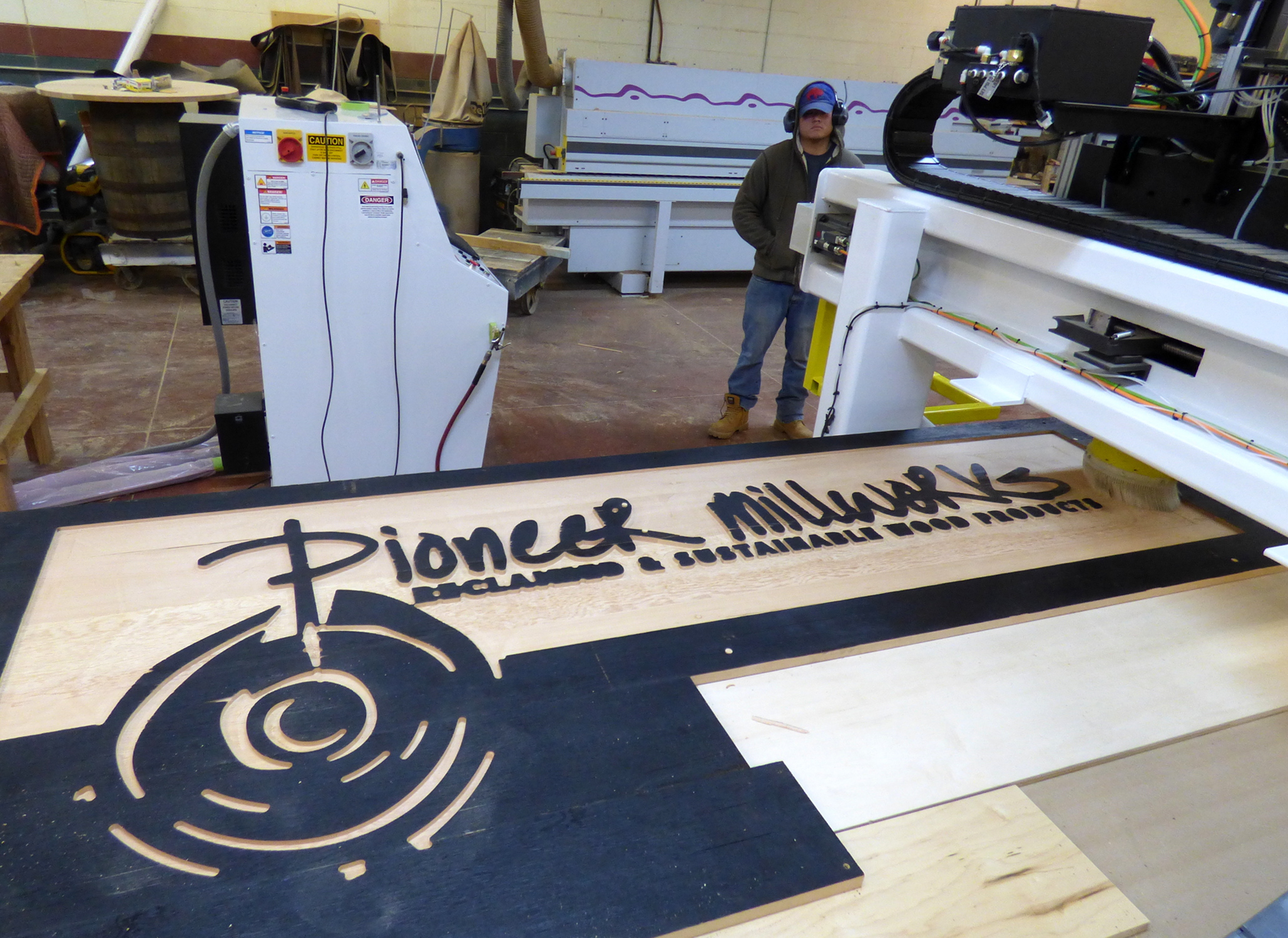 Pioneer Millworks is also combining their custom finishing techniques with CNC detailing. A shou sugi ban finish was carved to create their Portland OR showroom sign.
