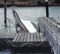Boat sinking at dock