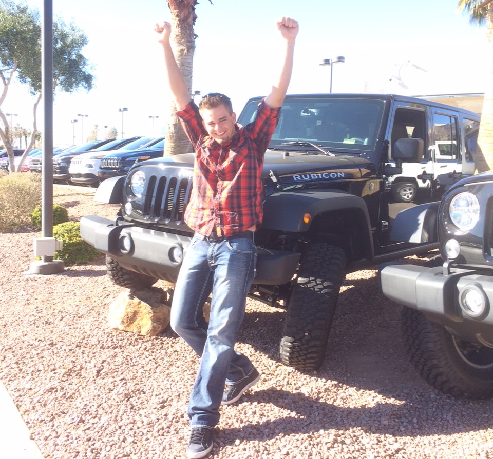 MonaVie distributor Cody Van Camp poses with his new Jeep