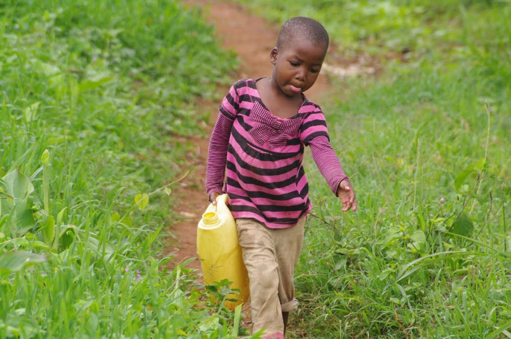 It’s all in a day’s work for this young Ugandan child who’s determined to bring water home for her Mom and thirsty siblings.