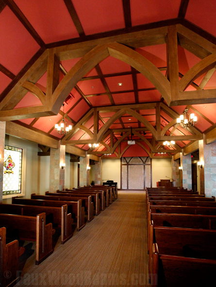 Woodland Modified Arched King Truss Faux Wood Beams, in a church.
