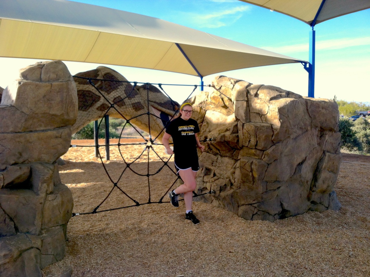 Enormous climbing boulders with a spider web net stretched between them give children a unique way to climb and explore.