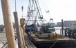 C. White Marine is installing timber fender piles at the Charlestown Naval Shipyard in Charlestown, Massachusetts where the USS Constitution, “Old Ironsides” is berthed.
