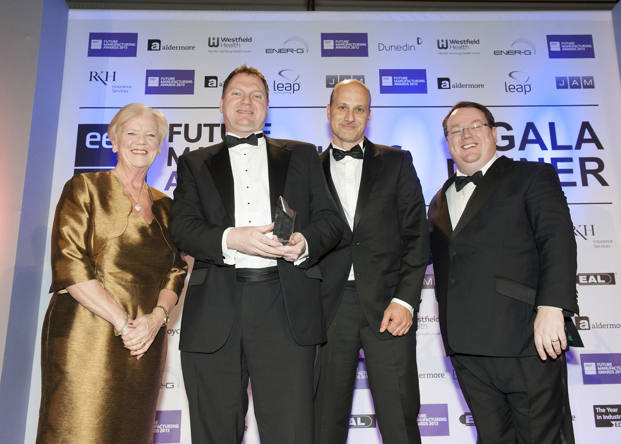Advanced Insulation - National Winner of The Business Growth Award (l-r) Jill Davies, Westfield Health CEO; Andrew Bennion and Asaf Hisherik, Advanced Insulation; Declan Curry, Awards Compere
