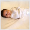 Slumber Sheet with Swaddle attachment helps baby sleep longer.