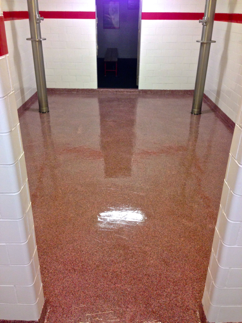 The walls were refinished in school colors, white with a red accent stripe.  The floors were refinished in a red and white flake pattern