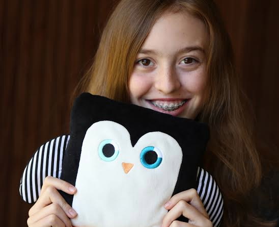Sydney Loew, Young Entrepreneur from Palo Alto, with her Poketti Penguin