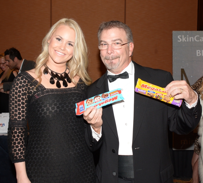 Bill Engval ready to enjoy some Megaload Chocolates while McKenna from Megaload Chocolate looks on