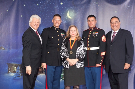 MGE Management Experts Client Dr. Susan Wells Receives US Marine Corps Toys for Tots Award