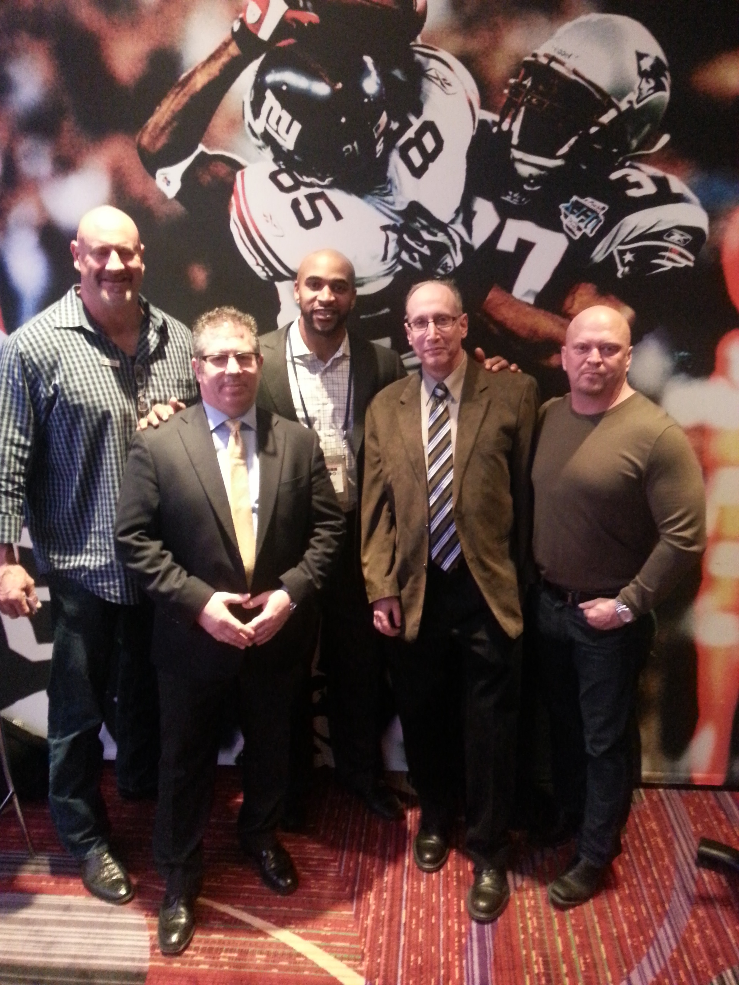 Mark Walczak, Dr. Neal Seltzer, David Tyree, Dr. Jeffrey Rein and David Gergen in the NFL Legends Lounge