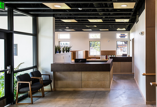 Reception area of the new Teton County School District Administration Office uses daylighting and transom windows for efficient interior lighting.