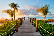 The Tuscany Resort's boardwalk leading to Grace Bay Beach is very welcoming.