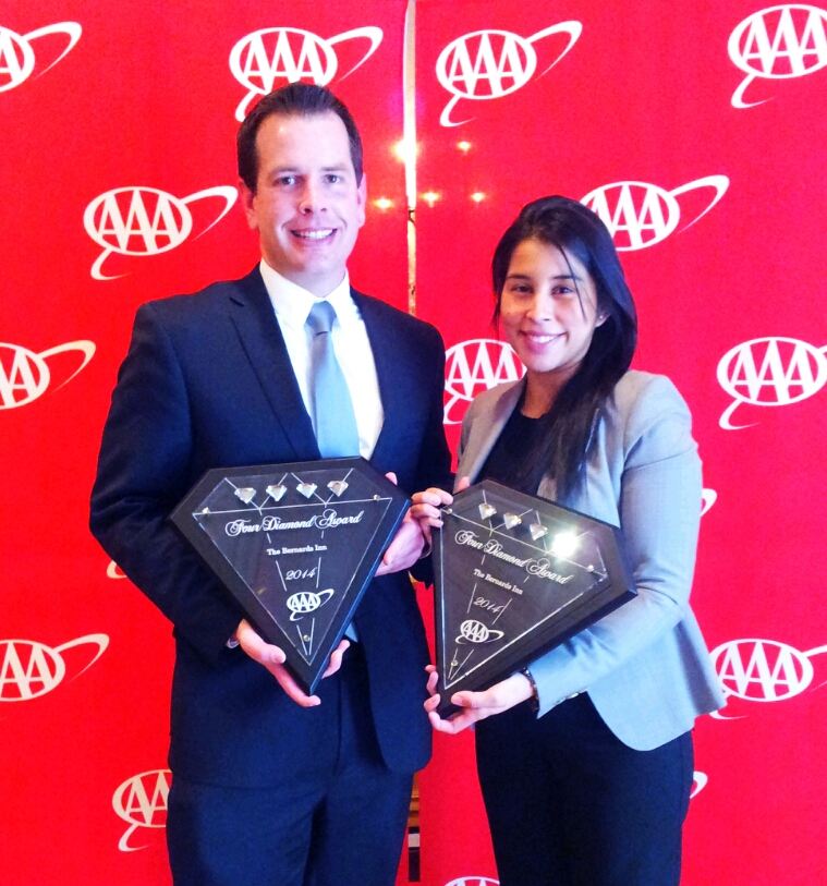 Joshua Barbee (left) and Leticia Penazola of The Bernards Inn Accept the AAA Four Diamond Award Plaques.