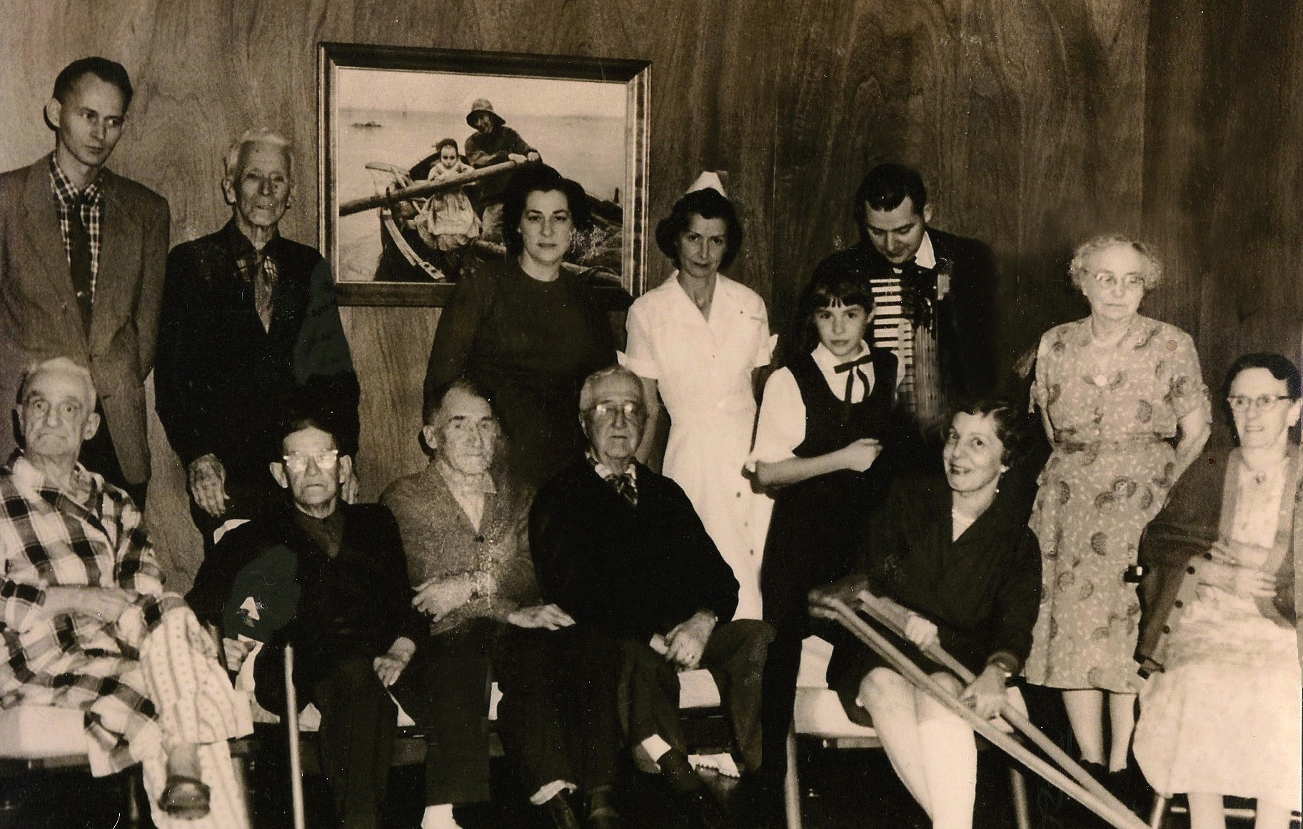 Rita M. Welch (top row; third from left) poses with residents and staff at John Scott House circa 1961.