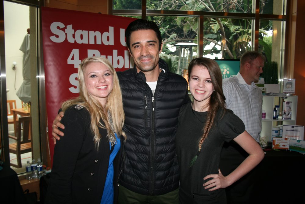 Gilles Marini talks about the Stand Up 4 Public Schools mission with fans at the Oscars Gifting Lounge.