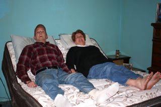 Easy Rest Adjustable Bed Sweepstakes winner Jimmie Kathryn Oleksy and her husband Gary test out the new features on their bed.