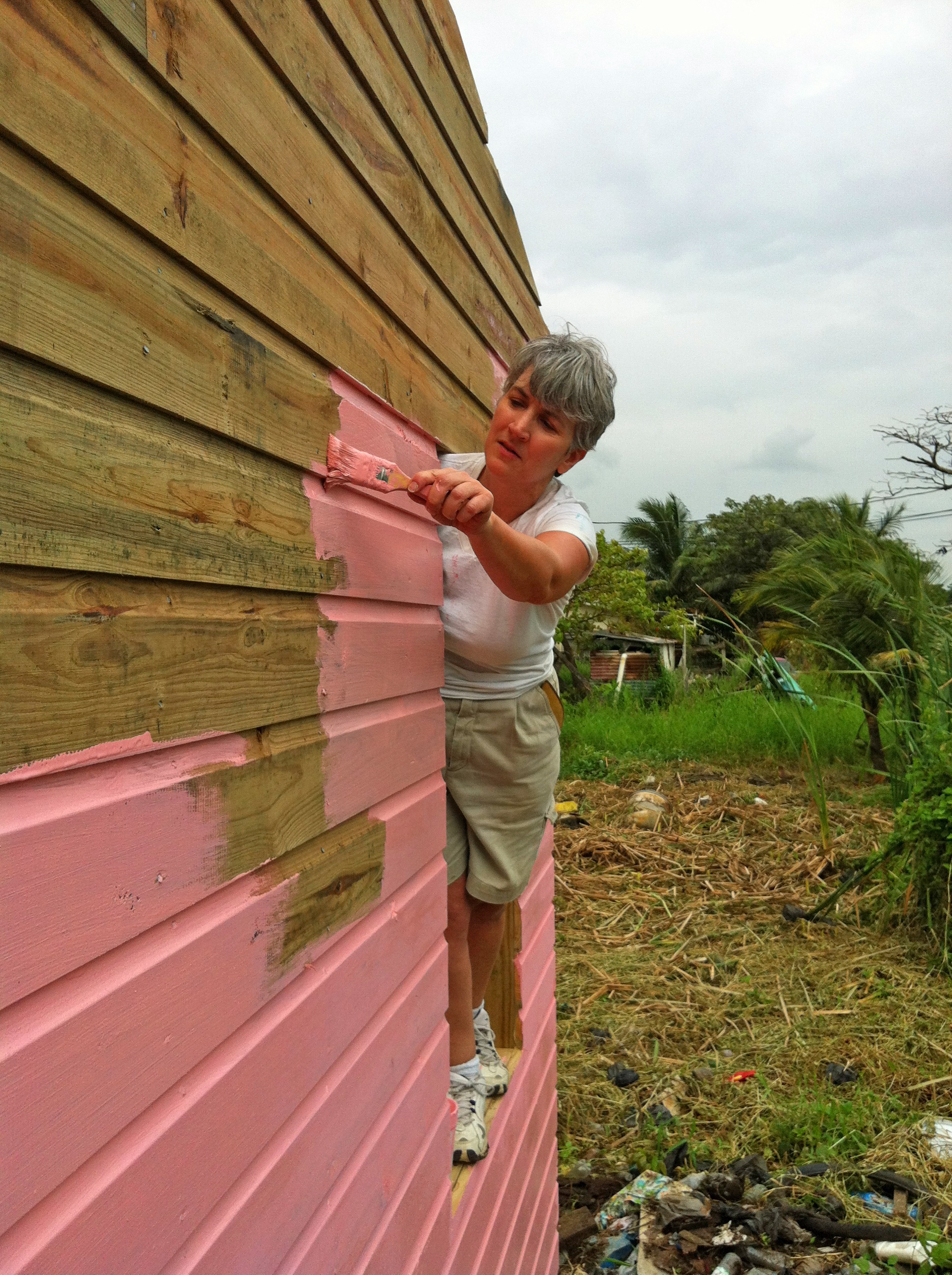 Kathy painting the new home