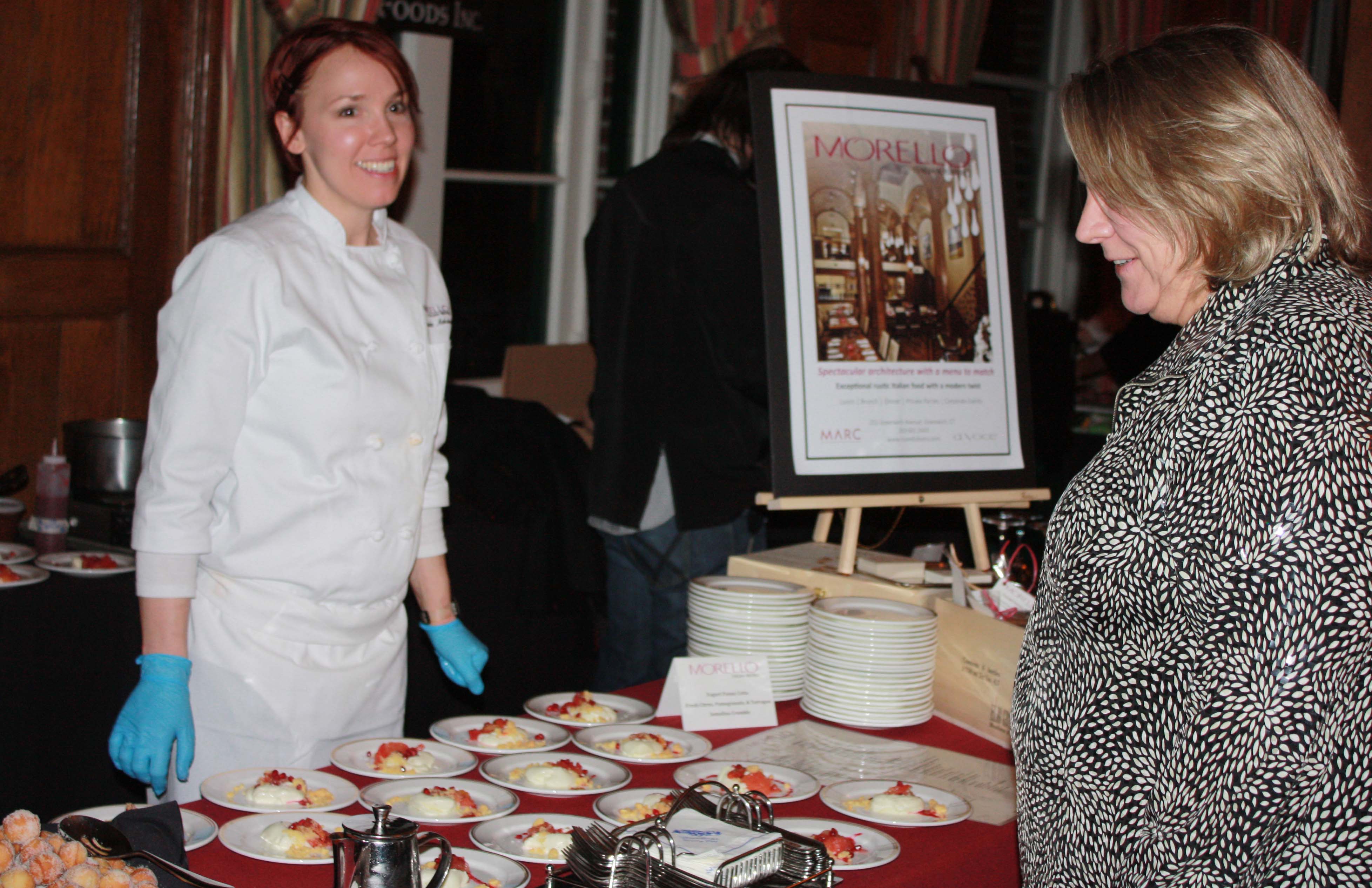 Morello chef Amanda Atkinson serves yogurt panna cotta at Greenwich Hospital’s annual Great Chefs fundraiser.