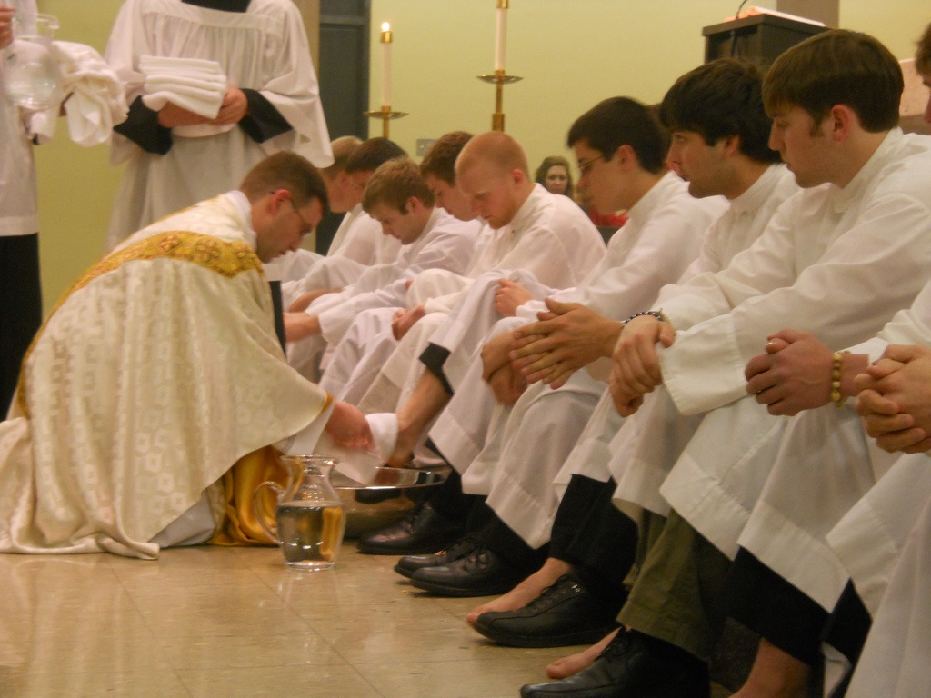 Fr. Ben Holdren washing feet of students