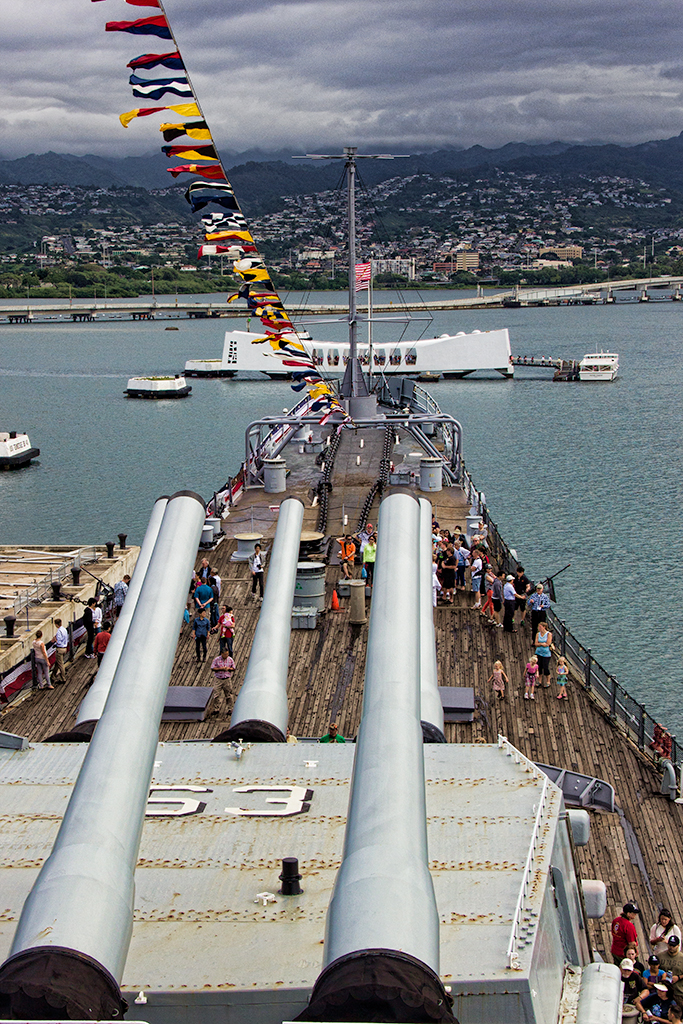 The USS Missouri is berthed bow-to-bow to the sunken USS Arizona in Pearl Harbor.