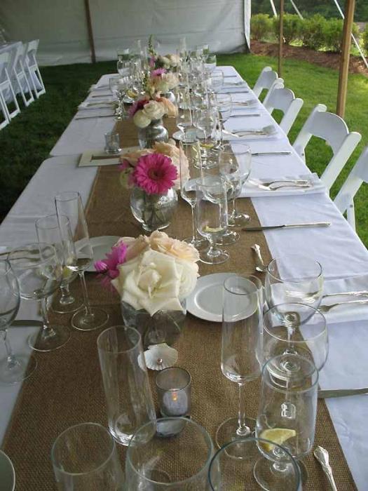 Play around with the table arrangement, long tables can be decorated with numerous small centerpieces.