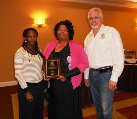 Zantae McCrae, Residential staff member of the year  Sonya White and board president James Montgomery.