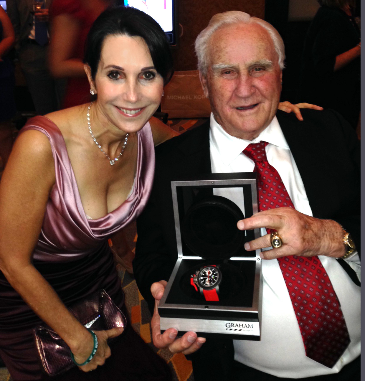 Robin Levinson of Levinson Jewelers with Coach Don Shula presenting GRAHAM donation watch