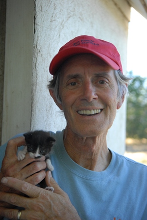 Gregory Castle, CEO of Best Friends Animal Society, with a community cat's kitten