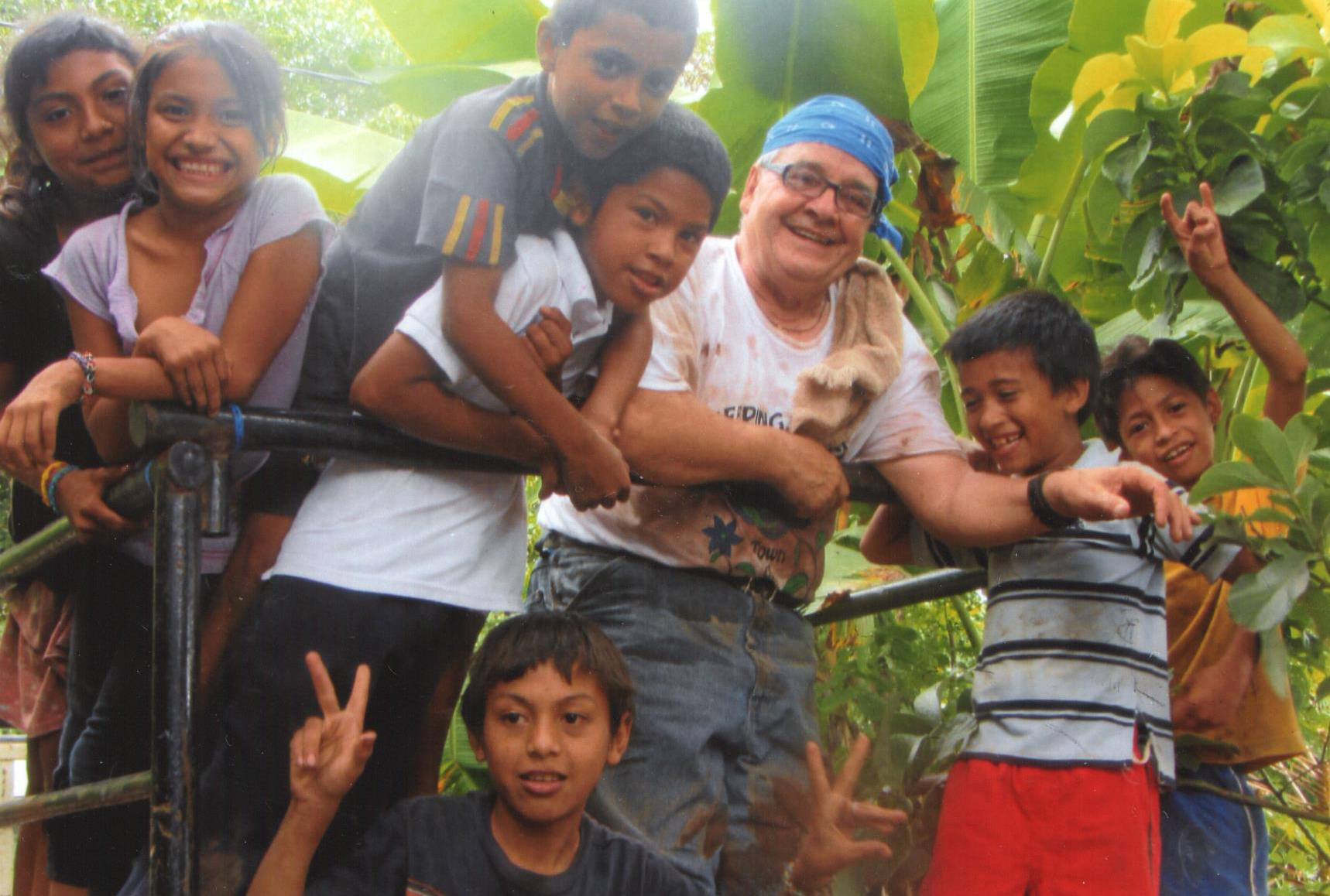 Tony with kids while building a house in the community of La Ceibita, Masaya in Nicaragua