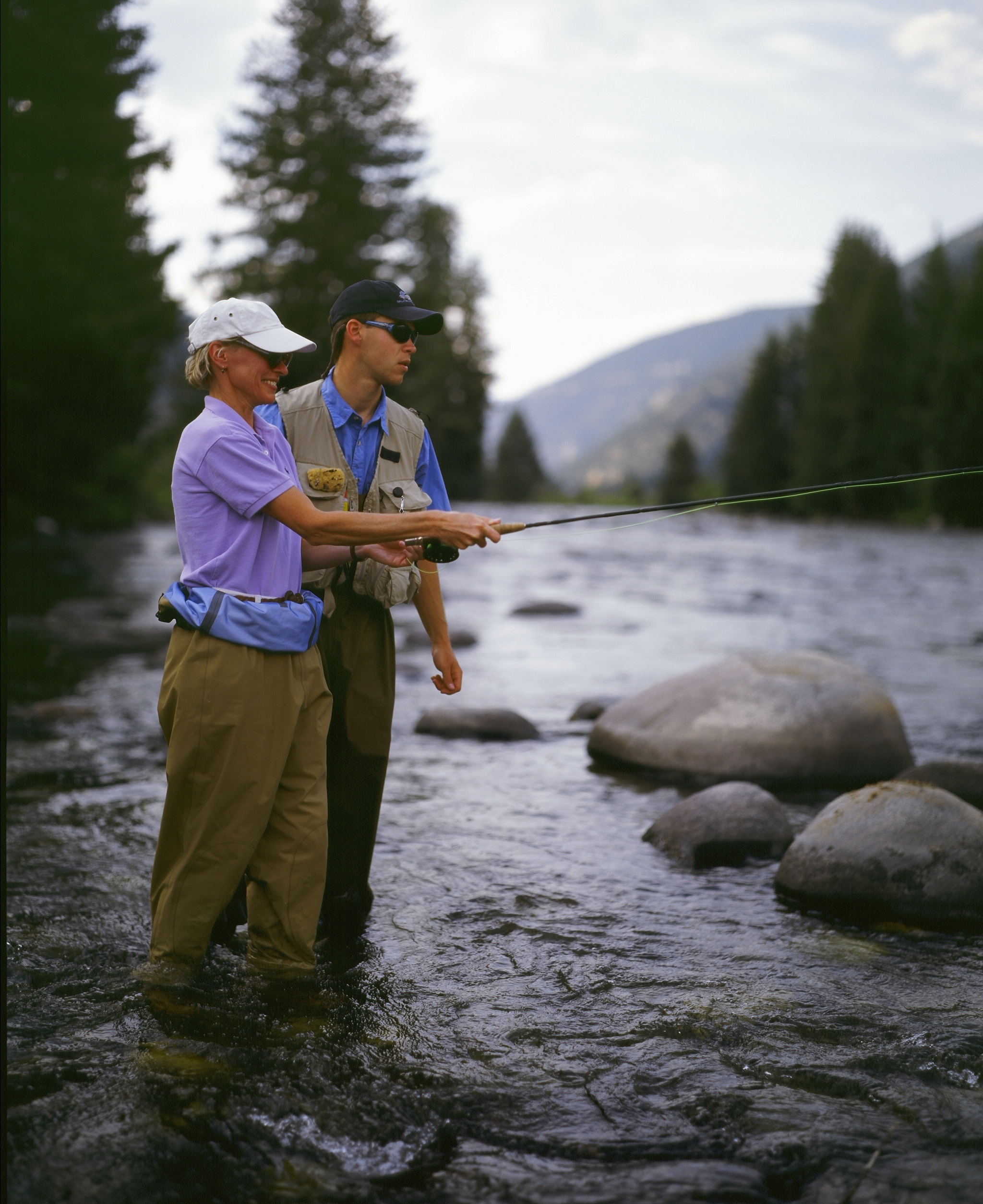 Fly fishing on the Gallatin River, a Blue Ribbon trout stream that runs through the 320 Guest Ranch