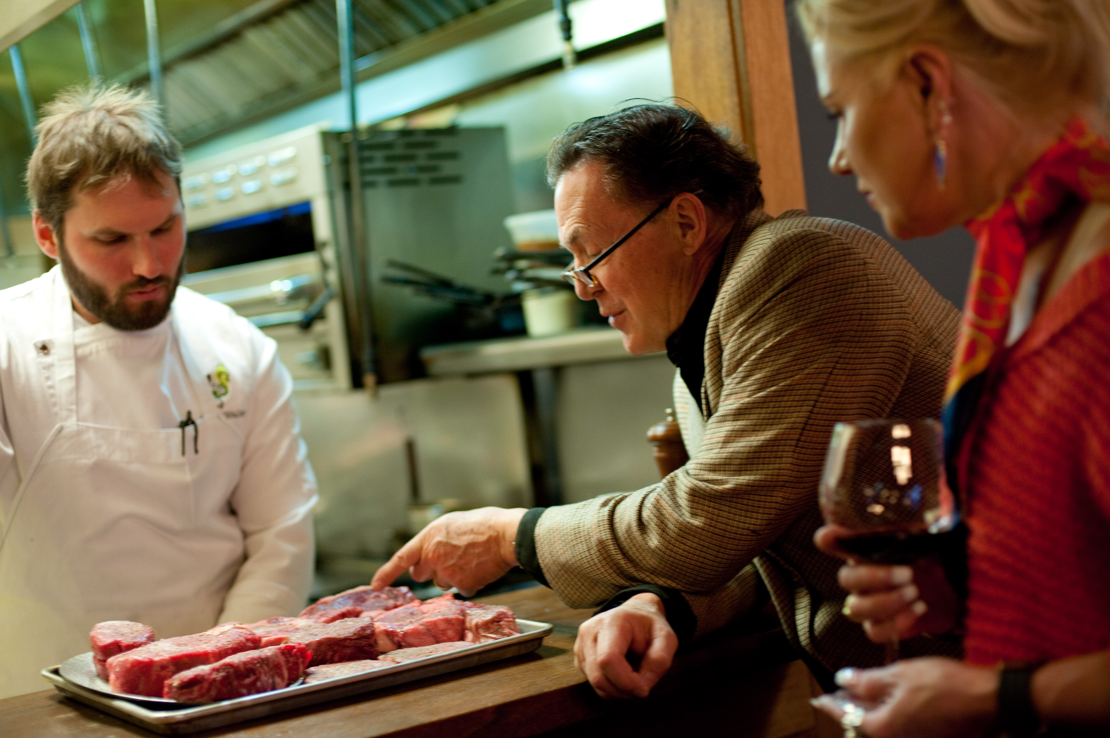Don Smith, founder of Omega3Beef and Chef Brad Walker of Boundary Road discussing quality cuts of beef