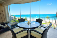 All oceanfront suites have a beautiful screened in porch - a wonderful place to watch sunsets over Grace Bay.